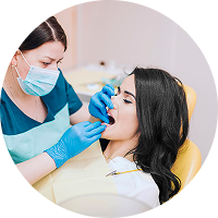 Dentist examining patient